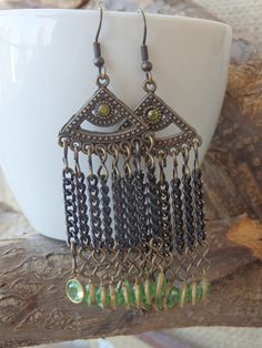 Chandelier green earrings. Green dangle earrings. Bohemian Fringes earrings. Crystal dangle chain earrings. Boho fringe earrings These green chandelier earrings are comfortable and unique, that will fit many styles and will be a perfect boho style gift for women. Metal: Brass, Oxidized Silver Gemstone: Length: 6 cm (2.36 inches) Width: 2.5 cm (0.98 inches) The earrings will be packed in a gift box. FOR MY EARRINGS COLLECTION HERE: https://www.etsy.com/il-en/shop/rebekajewelry?section_id=14222612 Purple Wedding Jewelry, Green Chandelier, Green Dangle Earrings, Climbing Earrings, Ear Crawler Earrings, Seashell Pendants, Boho Fringe, Earrings Bohemian, Garnet Earrings