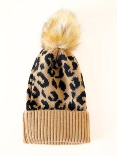 a leopard print hat with a pom - pom on top