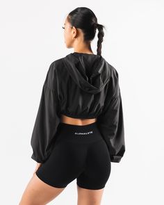 HIGHLIGHTS. Woven fabric Long sleeve Alphalete wolf logo FIT SUGGESTION. This item runs true to Alphalete's standard size... Jessica is 5’3”/160cm, wearing a size XS with a 30”/77.5cm bust. Sabrina is 6’0”/183cm, wearing a size XL. with 44.5"/113cm bust. MATERIALS AND WASHING DIRECTIONS. 100% Polyester. We recommend washing inside-out on a cold setting. Hang to dry DESCRIPTION With a silky smooth woven fabric, this jacket is perfect for wearing to and from the gym or during a cold outdoor workou Fitted Long Sleeve Sportswear Windbreaker, Fitted Functional Black Windbreaker, Black Long Sleeve Training Outerwear, Black Long Sleeve Outerwear For Training, Fitted Long-sleeve Sporty Windbreaker, Fitted Black Windbreaker For Sports, Black Fitted Windbreaker For Sports, Black Outerwear For Training In Fall, Sporty Fitted Black Windbreaker