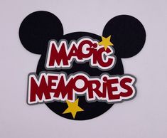 a mickey mouse sticker with the words magic memories written in red and yellow stars