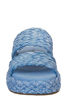 Woven raffia straps bring beachy vibes to an espadrille-inspired slide sandal cushioned by a pillowy footbed and lifted by a wrapped platform sole. 1 1/4" platform Raffia upper/rubber sole Imported Beach Sandals With Adjustable Strap, Beach Sandals With Adjustable Strap In Synthetic Material, Synthetic Sandals With Adjustable Strap For Beach, Vacation Espadrilles With Textured Footbed And Straw Material, Vacation Straw Espadrilles With Textured Footbed, Spring Beach Sandals With Adjustable Strap, Adjustable Strap Sandals For Spring Beach, Synthetic Slides With Adjustable Strap For Beach, Spring Beach Slides In Synthetic Material