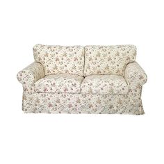 a white couch with floral print on it