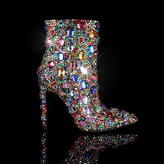 Create a dazzling fashion statement with these Rainbow Rhinestone Embellished Stiletto Heel Ankle Boots. Featuring a stunning rhinestone embellishment, these trendy and durable ankle boots are sure to become a favorite. Step out in style with confidence. Rubber sole Shaft measures approximately Ankle from arch Heel measures approximately 3.2 inch