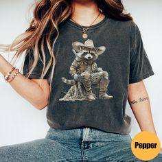 "Vintage Cowboy Racoon Shirt | Funny Western Trash Panda Tshirt | Retro 90s Graphic Tee | Weirdcore Meme Clothing | Oversized Shirt Matching Sweatshirt: https://printworkshopcompany.etsy.com/listing/1710066867/vintage-cowboy-racoon-sweatshirt-funny ** HOW TO ORDER 1. Check our photos for sizing and color options.  2. Select your size and color from the drop-down menus.  3. Click \"ADD TO CART\" to add the shirt to your cart. 4. Click \"PROCEED TO CHECKOUT\" to purchase your shirt. ** VIP Email L Acid Wash Grunge Tops With Sublimation Print, Grunge Relaxed Fit Top With Sublimation Print, Vintage Acid Wash Tops With Sublimation Print, Vintage Acid Wash Top With Sublimation Print, Acid Wash Graphic Tee Shirt, Distressed Graphic Tee Shirt In Relaxed Fit, Distressed Graphic Tee With Relaxed Fit, Acid Wash Graphic Tee With Funny Print, Casual Acid Wash T-shirt With Funny Print