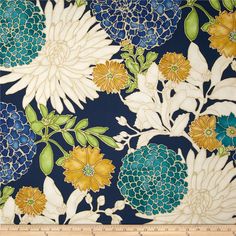 a blue and yellow floral print fabric with large flowers on it's back side