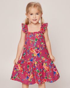 A celebration of summer's playful spirit. Vibrant blooms in hues of yellow, red, blue, and green dance on a sizzling hot pink canvas, exuding a sense of fun and joy. Embrace the lively energy of the summer season with this playful print, perfect for adding a bold splash of color to your sleepwear collection. The Celeste Lounge Dress boasts a lovely flutter at the shoulder and a comfortable a-line midi-length silhouette. A pretty gathered tier at the hem is our nod to your favorite summer sun dre Playful Sundress For Summer Garden Party, Playful Sundress For Garden Party In Summer, Playful Floral Sundress For Summer, Playful Floral Print Sundress For Summer, Fun Multicolor Print Summer Dresses, Multicolor Summer Holiday Dresses, Fun Multicolor Summer Dress, Vibrant Multicolor Print Dress For Spring, Vibrant Spring Dresses With Multicolor Print