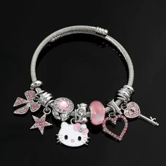 Adorable Hello Kitty Charm Bracelet! Comes Complete With 7 Charms Plus Spacers. Hypoallergenic. Great Gift For Hello Kitty Fans Young Or Not So Young. Comes In A Gift Box With A Pretty Organza Ribbon. Bundle & Save. Proceeds Will Help Cats & Kittens In Need. Hello Kitty Charm Bracelet, Cute Metal Charm Bracelet, Casual Silver Charm Bracelet As Gift, Cute Silver Hypoallergenic Bracelets, Cute Hypoallergenic Silver Bracelets, Trendy Silver Jewelry With Cat Design, Cute Silver Stainless Steel Jewelry, Cute Silver Bracelets With Charms, Casual Silver Charms Jewelry