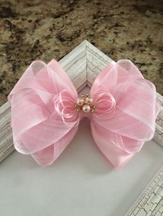 "This beautiful handmade hair bow would be perfect for everyday wear or special occasions. The 5\" bow is mounted on a 2 3/4\"  french barrette clip and measures approximately 6\" X 4.5\". The bow ribbons have treated ends to prevent fraying. I could also mount the bow on a 2 1/4\" single prong alligator clip upon request. This listing is for one hair bow in PINK color. This hair clip is handmade with top quality materials and made to last. I craft it from my home studio. Please continue to chec Wedding Hair Bow, Flower Girl Hair Bows, Easy Hair Bows, Communion Hair, Communion Hairstyles, Pink Hair Bow, Flower Girl Hair, Elegant Headband, Pink Hair Bows