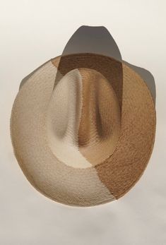 We teamed up with woman ran UNSECO protected artisans in Ecuador, the original origin of the Panama hat. Together we created a two toned western cowboy hat, with the classic panama technique. Handcrafted out of 100% natural toquilla straw. Natural coloring on the left side, toasted toquilla on the right. A cattleman crown measuring 12cm & brim at 9cm. This hat celebrates & honors indigenous women who weave the Panama hat. An art & craft that has been passed down among generation. Adjustable- Vel Western Six-panel Hat For Rodeo, Artisan Fedora Panama Hat For Rodeo, Western Six-panel Rodeo Hat, Brimmed Beige Panama Hat For Ranch, Western Beige Fedora Made Of Toquilla Straw, Western Style Beige Fedora In Toquilla Straw, Western Beige Fedora In Toquilla Straw, Beige Brimmed Panama Hat For Ranch, Western Beige Toquilla Straw Fedora