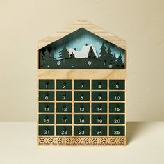 a wooden calendar with an image of a dog in the woods on it's cover