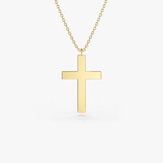 Gold KT: 14K Custom Gold Color: Rose Gold, Yellow Gold, White Gold Cross: 18 x 11 MM This 14k plain gold dangling cross necklace is a simple yet stunning accessory that will add a touch of sophistication to any outfit. The delicate gold chain holds a beautifully crafted cross charm that dances elegantly with every movement. Measuring approximately 18mm in size, this necklace is the perfect size for everyday wear, and the 14k gold construction ensures that it will last for years to come. Cross Charm Necklace, Gold Letter Necklace, Gold Letter, Cross Jewelry, Gold Letters, Gold Cross, Cross Charms, Recycled Gold, Letter Necklace