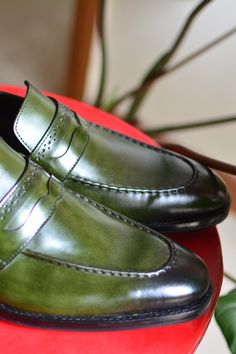 Green patina finish and hand-dyed loafers with stack heels and stitchline detailing.
Composition: Argetenian Full Grain Crust - Leather
Color: Green
Hand dyed
Stacked 25mm
Leather sole and heel
Heel height (in cm): 0.75 - Aza Fashions Classic Green Loafers With Brogue Detailing, Classic Green Tassel Loafers With Leather Sole, Green Plain Toe Loafers With Leather Sole, Green Leather Sole Loafers With Plain Toe, Classic Green Moccasins For Formal Occasions, Formal Green Moccasins With Leather Sole, Green Almond Toe Loafers With Leather Sole, Green Leather Sole Plain Toe Moccasins, Green Plain Toe Moccasins With Leather Sole