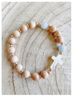 Need reminders to pray the Rosary? The Rosary Bracelet with Mother of Pearl Cross is the perfect daily wear piece to add to your Catholic jewelry collection. Handmade using rosewood and aquamarine beads, it is eye-catchingly beautiful. Rosewood and aquamarine beads Mother of Pearl Cross Stretch bracelet fits most Includes "How To Use Your Rosary Bracelet" card Made in the USA Rosary Bracelet Diy, Catholic Rosary Bracelet, Pray The Rosary, Catholic Bracelet, Bracelet Card, Rosary Jewelry, Communion Decorations, Prayer Bracelet, Beads Craft