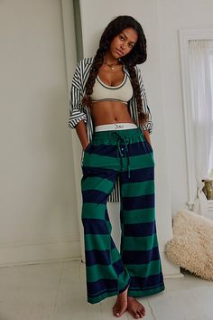 We’re living in these comfy cotton lounge pants from Intimately, featured in a flared silhouette with wide stripes and an adjustable waistband for endless wear in or out of the house. **Fit:** Relaxed, flared, mid-rise **Features:** Comfy cotton fabrication, wide stripes, elastic waistband with adjustable drawcord, button-fly details **Why We | You Wish Flare Pants by Intimately at Free People in Blue, Size: M Wide Stripes, Adjustable Waistband, Navy Green, Navy And Green, Striped Pants, Lounge Pants, Clothes Gift, Flare Pants, Active Wear For Women