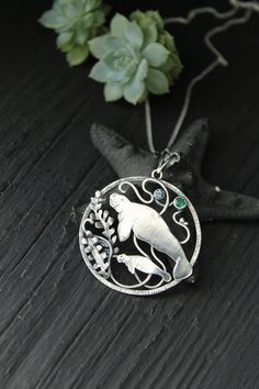 ITEM DESCRIPTION: The size of the pendant - H 4 х W 4 cm (1 1/2 x 1 1/2 inches), weight 8g. Jewelry will come to you in a gift box - ready for gifting. I made this motherhood jewelry of sterling silver, hydrothermal emerald, and topaz London. This unique necklace looks so touching. This is a story of the relationship between parents and children. It is not easy. But this is important for each of us. I hope this wire wrapped necklace will be a wonderful gift for someone whole you love: for your m Spiritual Keepsake Pendant Jewelry, Silver Keepsake Amulet Jewelry, Spiritual Pendant Jewelry For Mother's Day, Sterling Silver Locket Jewelry As Gift For Mom, Sterling Silver Locket Necklace As Gift For Mom, Silver Jewelry With Large Pendant For Keepsake, Unique Engraved Necklace As A Gift, Round Large Pendant Jewelry Gift, Unique Engraved Necklace Gift