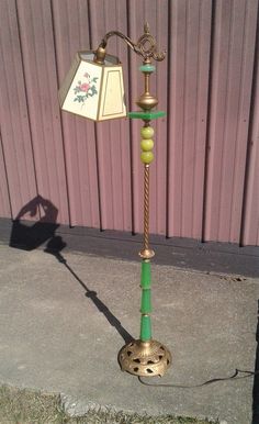 a lamp that is sitting on the sidewalk