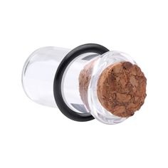 a glass jar with a cork lid and black rubber ring on the bottom that has a cork in it