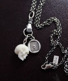 This a limited edition necklace that I've made combining a hand carved bone bead in the form of a perfectly detailed human skull and my 'mortality' amulet. Both were hung on a sterling silver charm holder and then on a nice solid Rolo chain. Mortality: this amulet is an impression of an antique wax letter seal which dates to the early 1800's. It features the image of a human skull. The text surrounding it states in French 'j'ai ete je suis, tu seras' or As you are, so once was I. Reminding us th Seal Jewelry, Wax Seal Jewelry, Antique Wax, Bone Pendant, Gothic Necklace, Necklace Antique, Skull Jewelry, Skull Necklace, Halloween Jewelry