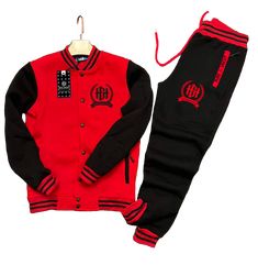 Stay comfortable and stylish with the Home Grown Hustler varsity set. This set includes a varsity jacket and matching jogger pants, both made from a soft and stretchy fabric. The relaxed fit allows for maximum mobility, while the bold logo adds a touch of flair. Whether you're running errands, meeting up with friends, or just lounging at home, this varsity set is a perfect choice. Plus, it's easy to care for – just toss it in the wash and it's good as new. Available in sizes S-XXXL, this varsity Cheap Varsity Tops With Direct To Garment Printing, Casual Black Fitted Varsity Jacket, Casual Fleece Joggers For Sports Season, Casual Red Fleece Activewear, Black Tracksuit With Letter Print For Streetwear, Black Letter Print Tracksuit For Streetwear, Casual Cotton Varsity Jacket With Letter Print, Leisure Sportswear Joggers For Sports Season, Fleece Athleisure Tracksuit For Leisure