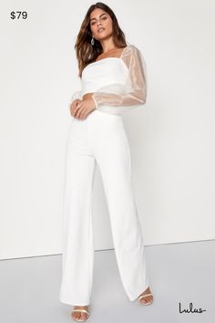 You'll get all the attention when you arrive at the party wearing the Lulus Sheerly Sultry Ivory Organza Balloon Sleeve Two-Piece Jumpsuit! Airy woven organza shapes sheer balloon sleeves (with elastic at the cuffs and shoulders) that frame a cropped bodice (composed of stretchy crepe knit) with flattering bust darts. Matching high-rise bottoms have wide pant legs. Hidden back zipper. Fit: This garment fits true to size. Length: Floor length. Size medium Inseam: 33.00 Front Rise: 12.00 Bust: Great for any cup size. Waist: Fitted - very fitted at natural waist. Hip: Loosely Fitted. Undergarments: May be worn with a strapless bra, adhesive bra, petals, or no bra. Fabric: Fabric has some stretch. Lined. Shell: 96% Polyester, 4% Spandex. Contrast: 100% Polyester. Lining: 100% Polyester. Hand W White Pant Suit Wedding, Women’s White Suit, Elegant Evening Bodysuit For Party Season, Elegant Bodysuit For Date Night And Party Season, Chic Long Sleeve Bodysuit For Party Season, Elegant Bodysuit For Night Out And Party Season, Elegant Bodysuit For Night Out Party, Chic Long Sleeve Pantsuit For Party, Elegant Party Bodysuit For Party Season