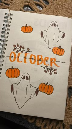 an open notebook with the words october written on it