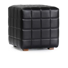 a black leather stool with wooden legs and square design on the top, in front of a white background