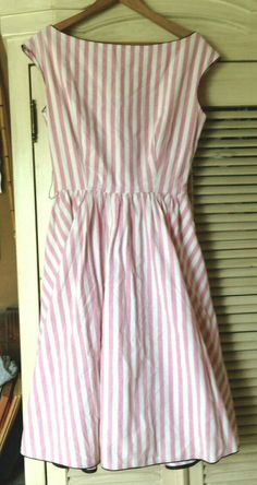 Barboglio Cristina Jan Vintage pink/white stripe cotton Party Dress Beautiful vintage dress - I am guessing 70's or 80's, The style says 50's and it is a timeless beauty. in excellent condition - nice and clean has crinolen under skirt to give it body and shape - not too much but just enough has dark contrasting piping detail around edges. measures taken laying dress flat: Use for proper fit - skirt length 22" from waist to hem top length  13" from neck to waist shoulders across  18" waist acros 80’s Dresses, 1980 Dress, Housewife Dress, Cotton Party Dress, Under Skirt, Old Fashion Dresses, Vintage Summer Dresses, 1980s Dresses, 80s Dress