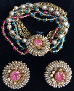 "Here is a spectacular vintage multi-strand bracelet and earrings set by designer Miriam Haskell. The bracelet is composed of six enchanting strands, three of which are fashioned with glistening and translucent glass beads in a gorgeous aqua blue and a luscious cranberry tone, a single strand crafted of gleaming faux pearls and two strands of gold tone double link chains that exhibit an attractive, warm golden patina. The glass beads and pearls are all gilt filigree capped and linked in-between Miriam Haskell Jewelry, Translucent Glass, Multi Strand Bracelet, Miriam Haskell, Fashion Jewelry Sets, Retro Jewelry, Old Jewelry, Fabulous Jewelry, Strand Bracelet