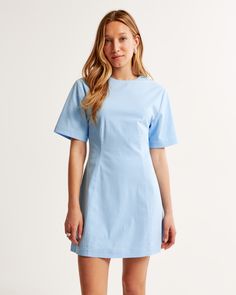 Flattering short-sleeve mini dress in our stretch-enhanced cotton fabric and body-skimming silhouette, featuring seaming details along the bodice, crew neckline and a hidden back zipper closure. Turquoise Dress, American Clothing, Short Sleeve Mini Dress, Light Turquoise, Mini Dress With Sleeves, American Apparel, Evening Wear, Women's Dresses, Stretch Cotton