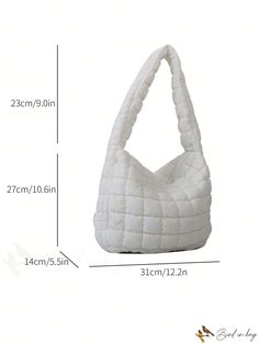 a white purse is shown with measurements