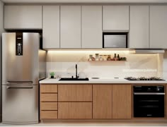 a modern kitchen with stainless steel appliances and wood cabinets