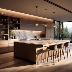 a modern kitchen with marble counter tops and bar stools in front of an open window