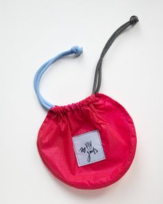 flat lay of drawstring pouch in hot pink, light blue and grey with bag closed Upcycled Bags, Running Bag, Pink Pouch, Foreign Coins, Upcycled Bag, Chalk Bags, Slow Fashion Brands, Pink Ballerina, Fabric Accessories