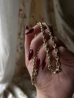 Simple and sophisticated, this late 19th century English chain perfectly encapsulates iconic Victorian artistry. Crafted in 15 carat gold, this chain is fashioned in an archaeological revivalist manner, featuring delicate hand wrought links that gradually increase in size until they terminate in large, elegant boules. The most stunning detail in this piece is the fully hallmarked jump ring in the center. With its timeless silhouette, this chain can be worn alone as a statement piece, or layered Classic Yellow Gold Metal Chain Necklace, Gold-tone Rope Chain Jewelry For Formal Occasions, Elegant Rope Chain Link Jewelry, Elegant Tarnish Resistant Oval Link Chain Necklace, Elegant Oval Link Tarnish Resistant Chain Necklace, Elegant Tarnish-resistant Oval Link Chain Necklace, Antique Gold Chain Link Jewelry, Gold Byzantine Link Jewelry, Elegant Brass Chain Necklace Tarnish Resistant