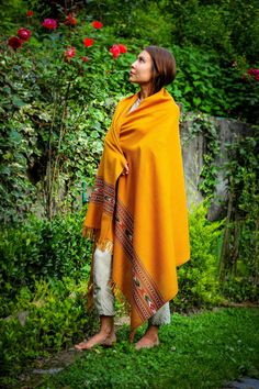 ART: S-06M COMPOSITION: 100% Merino wool SIZE: 100x200cm / 40x80in approx. THICKNESS: Medium DETAILS: With fringes WEIGHT: from 250g to 500g / from 0.5lb to 1lb This shawl is a living testimony to the Himalayan culture. Traditionally, we recognized where a person came from by the motif we found on his shawl or hat. Each motif is represented by a region of the Himalayas. This particular Himalayan shawl, specifically, presents us with the traditional motif of the Kullu region. Over time, the distinction of regions by their patterns has become less evident and now different regions produce a variety of patterns. The weaving of these shawls requires a certain expertise and a long application to create such exceptional borders. With its finesse, too, it is fabulous as an accessory and adds a re Bohemian Wool Shawl, Shawl Photoshoot, Wool Art, Clean Towels, The Himalayas, Wool Shawl, Aging Well, Clothes Line, Embroidery Projects