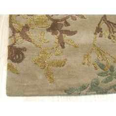 an area rug with flowers and leaves on it