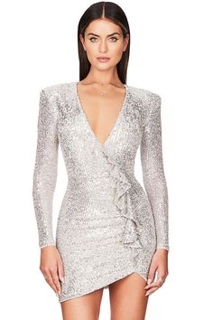 Description: No dresses are more party-ready than sparkly sequin dresses for women. You just look captivating in the party with this sparkling galaxy long sleeve ruffle deep V sequin mini dress. Designed with a plunging V neckline with cascading ruffles at front, long fitted sleeves, a bodycon silhouette with a hidden zip closure, dazzling sequins throughout, and a short dress cut with an asymmetrical hem, this stunning holiday mini dress in our boutique will take you smoothly from fancy events Knit Dress Pattern, Wear To Work Dress, Sequin Dresses, Cascading Ruffles, Off Shoulder Dresses, Zebra Dress, Fitted Sleeves, Sleeveless Long Dress, Half Sleeve Dresses