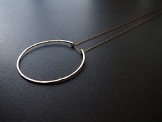 "Simple Circle Necklace  A simple circle shape on a delicate 18\" or 24\" chain. Diameter of circle: 2.25\" Necklace is shown on a 18\" chain. Available in solid sterling silver (925) and 14k gold fill.  green tea leaves is handcrafted, cut, shaped, and finished with a lightly hammered texture.  Is this a gift? All pieces arrive ready to gift. Please let me know the recipient's shipping address in a \"Note to Seller.\"" Gold Hoop Sterling Silver Necklace, Sterling Silver Hoop Necklaces In Gold Color, Gold Hoop Sterling Silver Necklaces, Gold Sterling Silver Hoop Necklaces, Minimalist Hoop Jewelry With Delicate Chain, Circle Cable Chain Necklaces For Gifts, Sterling Silver Hoop Necklace In Yellow Gold, Minimalist 14k Gold Open Circle Necklace, Dainty Hoop Necklaces As Gift