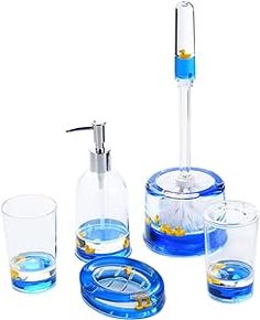 a blue bathroom set with soap dispenser, glasses and toothbrush holder