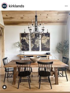 a dining room table with four chairs and a chandelier hanging from the ceiling