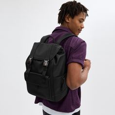 Made for a life in constant motion the League keeps your game plan on track. Crafted of smooth leather this roomy backpack is a comfortable choice for every day with its padded back and straps. Organized with multiple pockets inside and out the sporty style has a dedicated laptop sleeve and plenty of space for notebooks water bottles and other essentials. An exterior zipper gives easy access to the main compartment. | Coach League Flap Backpack - Black Sporty Outdoor Backpack With Multiple Pockets, Sporty Nylon Backpack With Multiple Pockets, Sporty Backpack With Adjustable Strap, Functional Leather Backpack For Outdoor Activities, Sporty School Backpack With Multiple Pockets, Black Leather Backpack For Outdoor Activities, Casual Black Leather Backpack For Outdoor Activities, Sporty Leather Backpack, Casual Black Leather Backpack For Outdoor