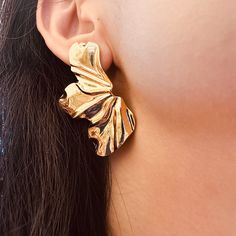 A big statement golden flower earrings that will elevate your party outfit. The exaggerate flower is coated in shiny gold color, has a weight of 9 g each flower. Materials: Alloy metalDimensions: 1.91 x 1.08 inWeight: 9g each earring Shipping Policy: Orders will be shipped within 1-3 business days. Economy shipping will take 7-14 days to arrive and standard shipping is 1- 4 days for U.S. orders. International shipping time is depended on the country and per shipping method. Shipping cost will be Golden Statement Earrings, Big Golden Earrings, Gold Earrings Big, Big Gold Earrings, Big Earrings Gold, Flapper Hair, Big Statement Earrings, Gold Earrings Wedding, Bold Accessories