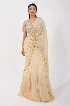 Gold pleated pre-draped skirt saree featuring attached sequin bead embellished pallu with applique and attached can can. Comes with bead embellished floral padded blouse. - Aza Fashions Elegant V-neck Lehenga With Zari Work, Elegant Georgette V-neck Blouse, Elegant V-neck Georgette Blouse, Elegant V-neck Pre-draped Saree For Festive Occasions, Elegant Lehenga With Zari Work And V-neck, Elegant V-neck Lehenga With Unstitched Blouse, Elegant Draped Semi-stitched Sharara, Elegant V-neck Lehenga For Festive Occasions, Anarkali Draped Dresses With Zari Work