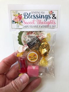 someone is holding some candy and candies in their hand while they are saying, sending you blessing & sweet the nights i hope you have a wonderful day