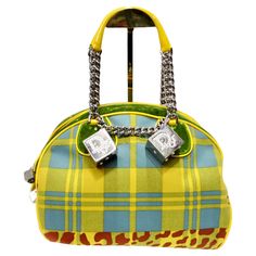 Introducing the Christian Dior Fall 2004 Gambler Dice Bowler Bag, a stunning creation by John Galliano for Christian Dior that exudes luxury and statement style. Crafted with meticulous attention to detail, this bowler-style top handle bag is a true masterpiece. The bag features a captivating contrast of yellow and blue plaid with hints of red leopard print and lush green velvet, creating a striking visual impact. The combination of textures and patterns adds depth and dimension to the design, s Custom Designer Bags, John Galliano Dior Bag, Botas Louis Vuitton, Cool Purses, John Galliano Dior, Galliano Dior, Vintage Thrift Stores, Bowler Bag, Gucci Dress