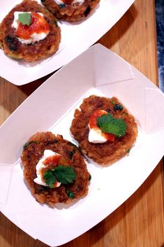 three plates with food on them sitting on a table