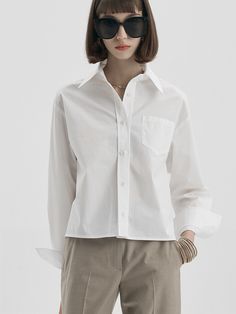 Editor's NotesMaLoupe's 4105 cropped pocket shirt with a soft texture and unique mood of MaLoupe. The shirt is comfortable and perfect for classic outfits.- 4105 cropped pocket shirt  - Oversized shirt with a cropped length- Pocket detail on the chest- Logo embroidery detail- Creates a semi casual moodMeasurements (inch)- Length: 21.6 inch- Shoulder: 18.5 inch- Chest: 21.6 inch- Sleeve: 22 inch*Model info: height 5'6 / waist 24 / fitting size FreeComposition & Care- 56% C White Collared Blouse With Pockets, White Relaxed Fit Blouse With Pockets, White Top With Pockets And Shirttail Hem, White Tops With Pockets And Shirttail Hem, Classic Collared Cropped Shirt With Pockets, Relaxed Fit Collared Cropped Shirt With Pockets, Collared Cropped Shirt With Pockets Relaxed Fit, Classic Cropped Shirt With Pockets For Spring, White Shirt With Pockets And Spread Collar