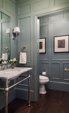 a bathroom with blue walls and wood floors is featured on the instagram page in japan