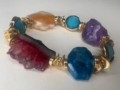 We'd love to introduce you to this Beautifully curated design of 4 Semi Precious Stone Mix bracelets. When we handcrafted this design, it became more than just a regular release of accessories. This design consists of years of collecting and finally piecing together. Ranging from an array of Amethyst, Agate and Amazonite, these precious stones are rare and are meant for only ONE person. If you resonate with these pieces, this is definitely for you. * Handmade Item * One of a Kind * Consists of 4 Luxury Adjustable Multicolor Jewelry, Luxury Bangle Bracelet With Natural Stones, Luxury Handmade Party Bracelets, Luxury Handmade Party Bracelet, Luxury Multicolor Stone Bracelets, Luxury Multicolor Bracelets With Stones, Unique Multi-stone Bangle Bracelet, Unique Multi-stone Bangle Bracelets, Luxury Multi-stone Bracelets As Gift