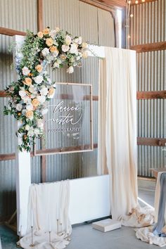 a wedding arch with flowers on it